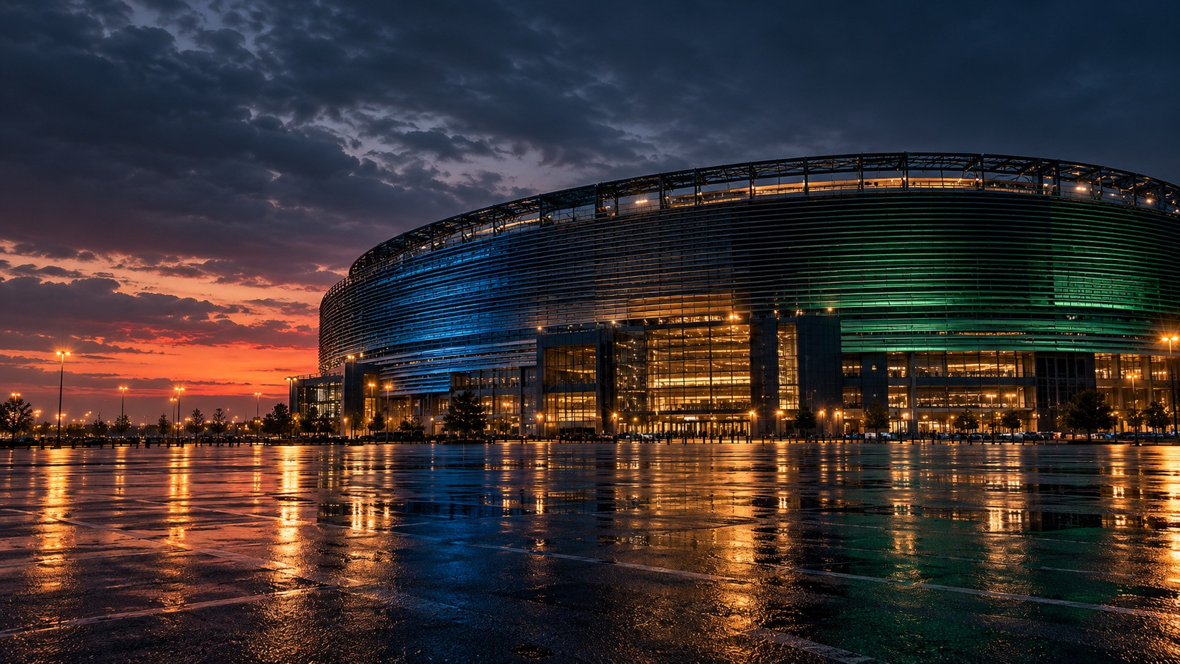 Rain-lit football stadium with blue and green lighting for a Giants and Jets prediction-markets guide.